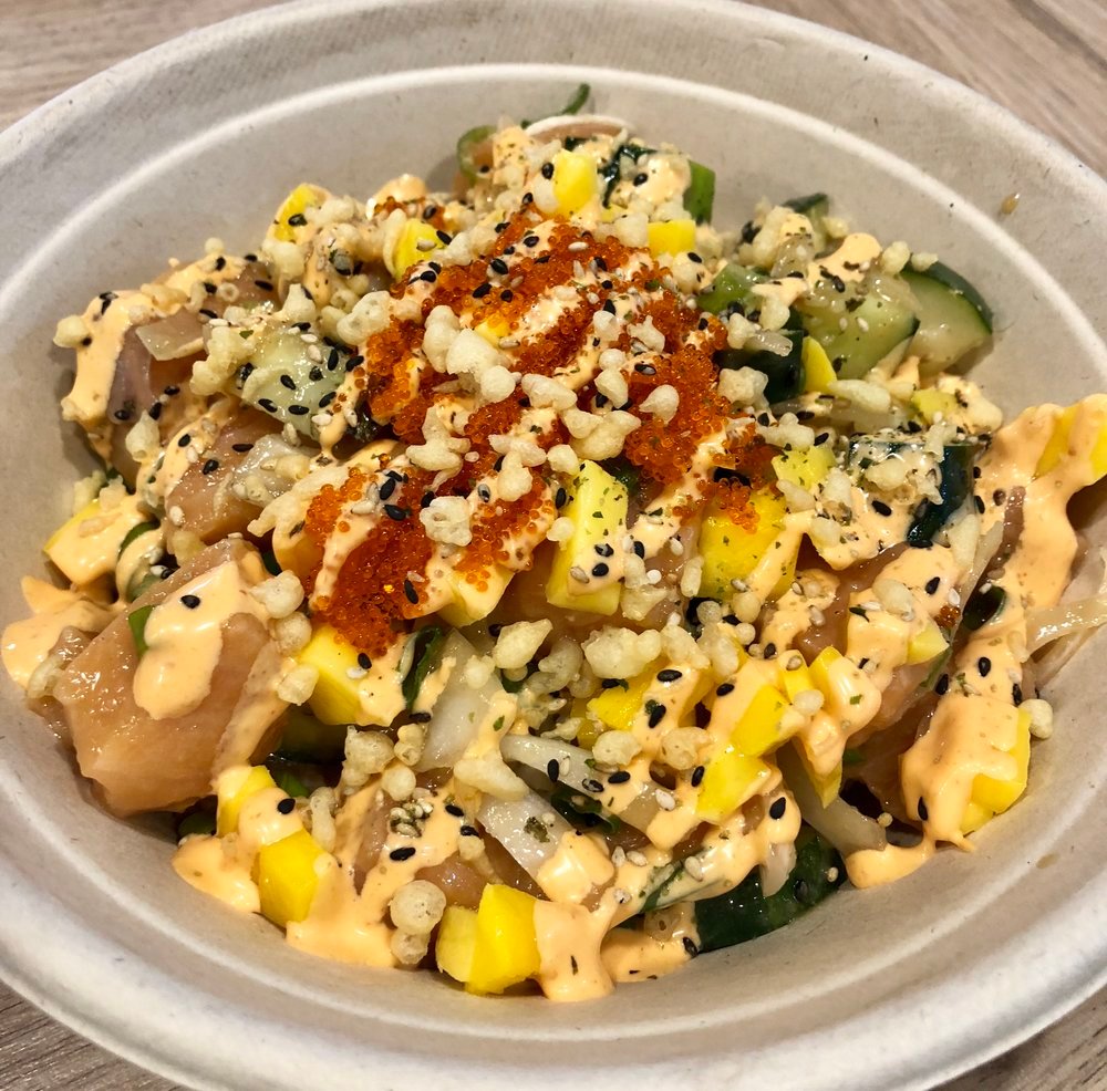 SRIRACHA MAYO   SALMON mixed with CUCUMBER, ONIONS, SCALLIONS, MANGO;  marinated in CITRUS, SPICY, GARLIC or GINGER PONZU;  topped with TOBIKO, FURIKAKE, TEMPURA CRISPS;  with SRIRACHA MAYO drizzle.