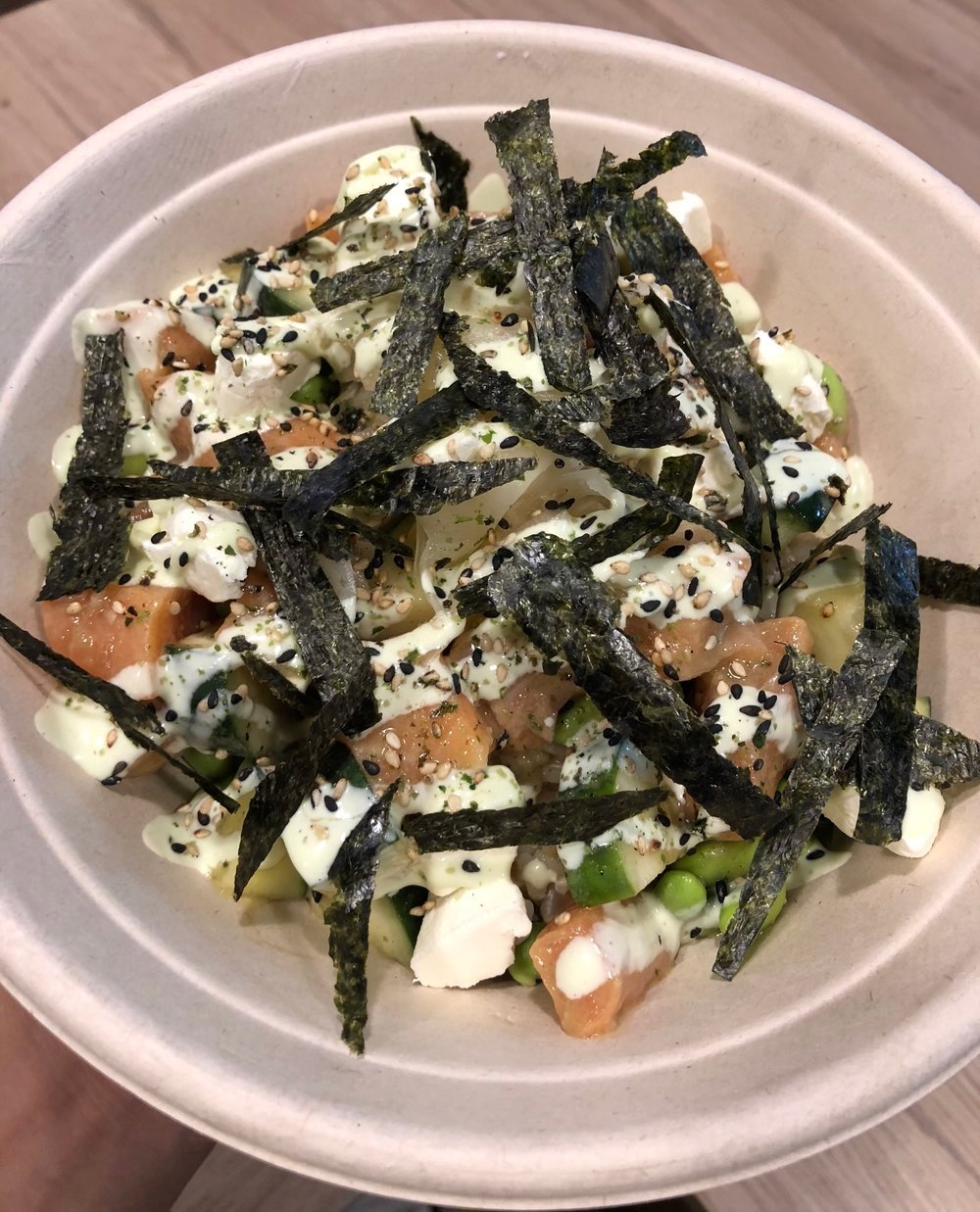 GATEWAY   SALMON mixed with CUCUMBER, EDAMAME;  marinated in WASABI PONZU;  topped with PICKLED GINGER, CREAM CHEESE, FURIKAKE, NORI;  with WASABI MAYO drizzle.